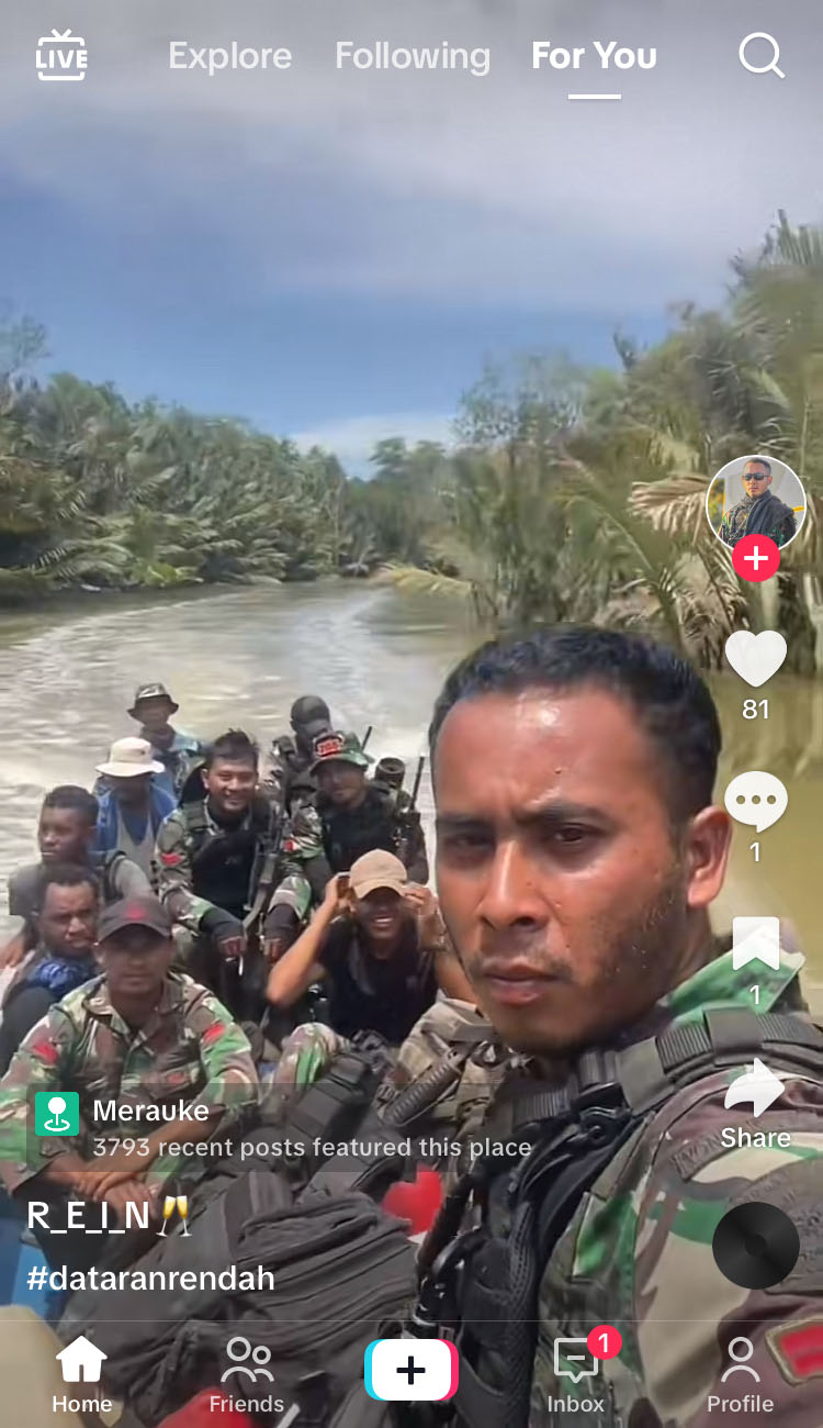 A screenshot from TikTok with a soldier taking a selfie on a boat loaded with other soldiers